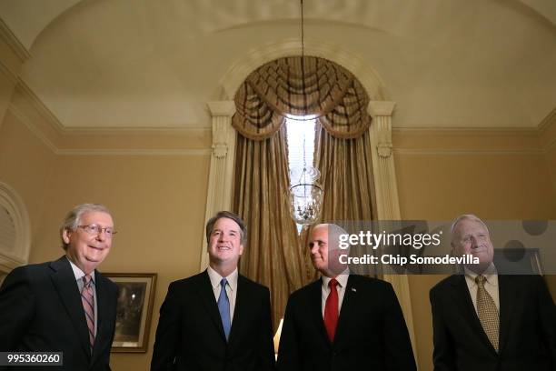 Senate Majority Leader Mitch McConnell , Judge Brett Kavanaugh, Vice President Mike Pence and former Sen. Jon Kyl pose for photographs before a...