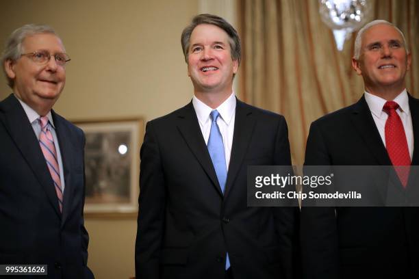 Senate Majority Leader Mitch McConnell , Judge Brett Kavanaugh and Vice President Mike Pence pose for photographs before a meeting in McConnell's...