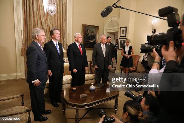 Senate Majority Leader Mitch McConnell , Judge Brett Kavanaugh, Vice President Mike Pence and former Sen. Jon Kyl pose for photographs before a...