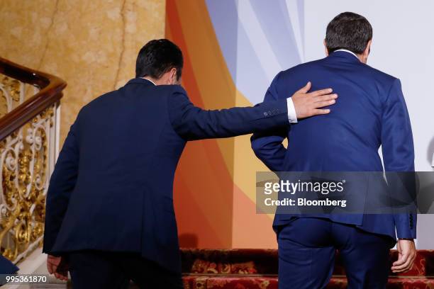 Zoran Zaev, Macedonia's prime minister, left, places his hand on the back of Alexis Tsipras, Greece's prime minister, at the Western Balkans Summit...