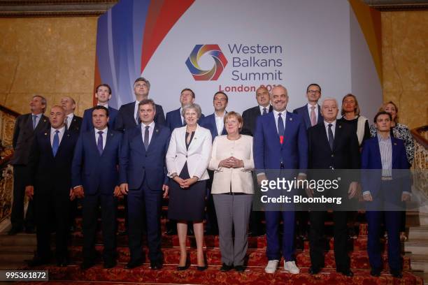 Attendees of the Western Balkans Summit 2018, including Theresa May, U.K. Prime minister, first row, center left, and Angela Merkel, Germany's...