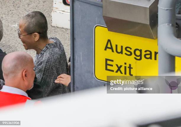 July 2018, Germany, Berlin: Liu Xia, widow of the Nobel Peace Prize laureate, Liu Xiaobo, has landed at Berlin Tegel airport and is picked up by car...