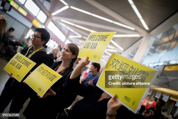 July 2018, Germany, Berlin: Helpers of Amnesty International waiting at Berlin Tegel airport for Liu Xia, widow of the Nobel Peace Prize laureate,...