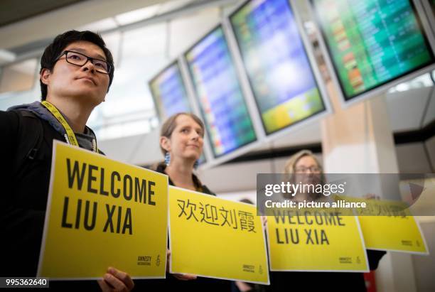 July 2018, Germany, Berlin: Helpers of Amnesty International waiting at Berlin Tegel airport for Liu Xia, widow of the Nobel Peace Prize laureate,...