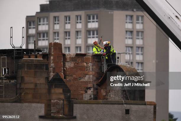 Workers begin the demolition of the burnt-out Glasgow Art School on July 10, 2018 in Glasgow, Scotland. The grade A listed building was undergoing a...