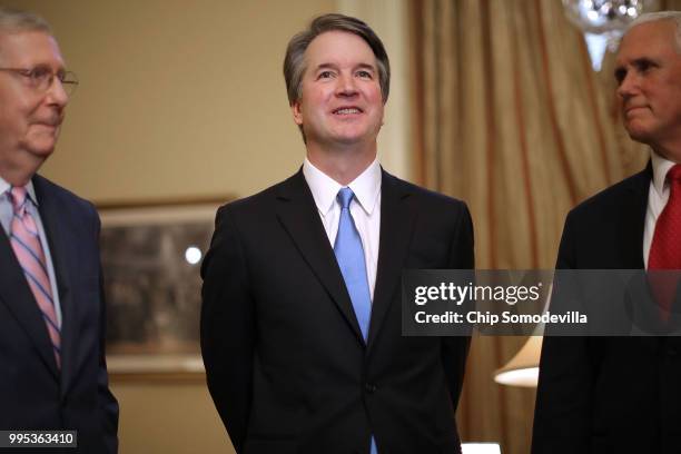 Senate Majority Leader Mitch McConnell , Judge Brett Kavanaugh and Vice President Mike Pence pose for photographs before a meeting in McConnell's...