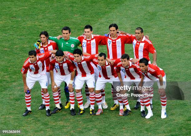 Paraguay line up for a group photo before the FIFA World Cup Round of 16 match between Paraguay and Japan at the Loftus Versfeld Stadium on June 29,...