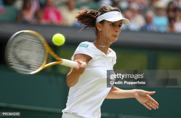 Tsvetana Pironkova of Bulgaria returns the ball against Vera Zvonareva of Russia in the Womens Singles Semi Final on day eleven of the 2010 Wimbledon...