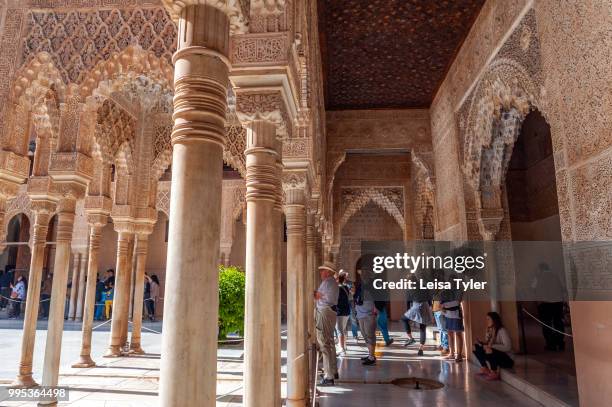 Columns line the Patio de los Leones in the Alhambra, a 13th century Moorish palace complex in Granada, Spain. Built on Roman ruins, the Alhambra was...