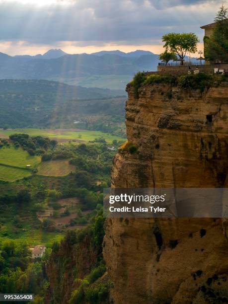 Sun streaks in front of the El Tajo Gorge in Ronda, a heritage town and popular tourist destination in Andalusia, Spain.