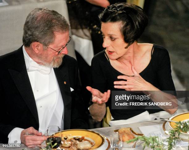 Nobel laureate in Physics Dr George E. Smith speaks with Nobel laureate in Literature Herta Mueller during the Nobel banquet in the Stockholm Town...