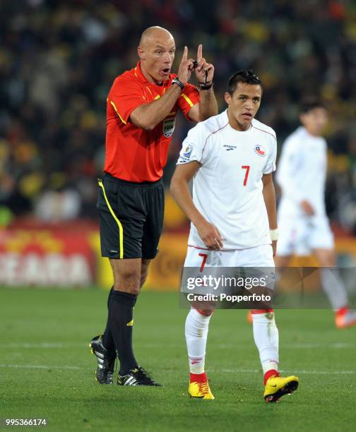 Referee Howard Webb talks to Alexis Sanchez of Chile during the FIFA World Cup Round of 16 match between Brazil and Chile at Ellis Park on June 28,...