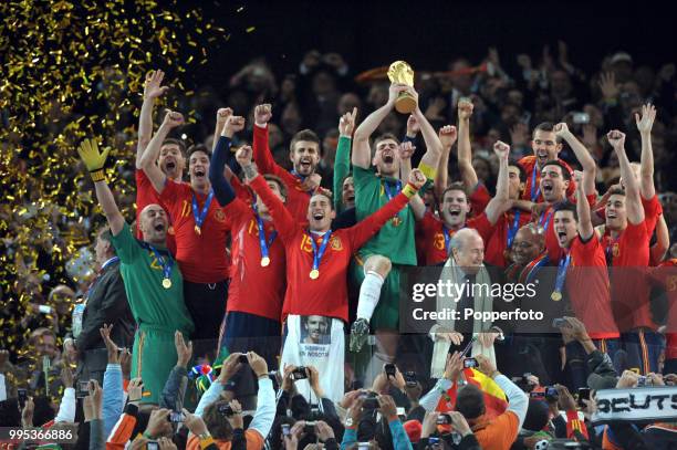 Iker Casillas of Spain lifts the trophy and celebrates with team-mates after the FIFA World Cup Final between the Netherlands and Spain on July 11,...