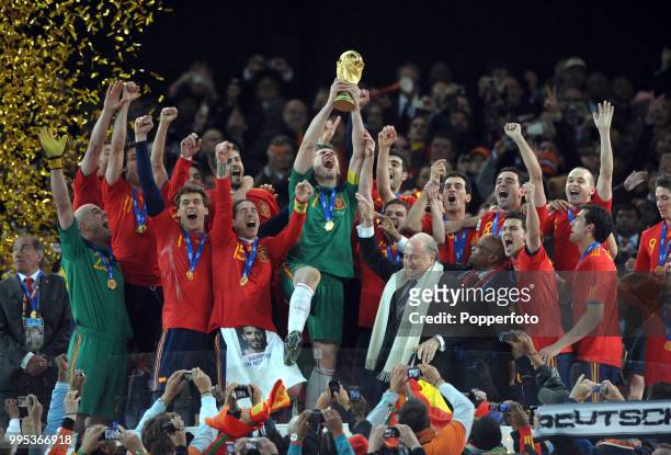 Iker Casillas of Spain lifts the trophy and celebrates with team-mates after the FIFA World Cup Final between the Netherlands and Spain on July 11,...