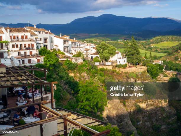 Restaurants and cafes overlook the El Tajo Gorge in Ronda, a heritage town and popular tourist destination in Andalusia, Spain.