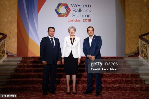 Macedonia's Prime Minister Zoran Zaev, Britain's Prime Minister Theresa May and Greece's Prime Minister Alexis Tsipras pose for a formal photo during...