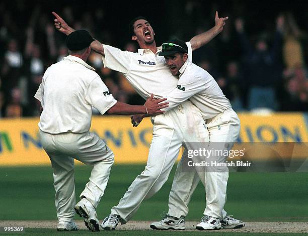 Jason Gillespie of Australia celebrates the wicket of Mark Ramprakash of England with Justin Langer during the third day of the Second Npower Test...