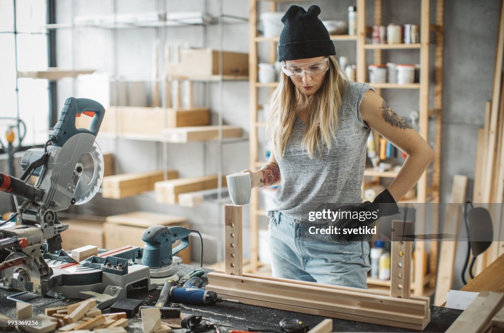 Woman carpenter in workshop