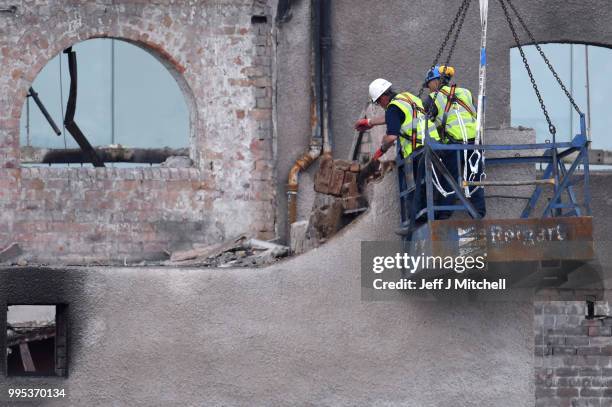 Workers begin the demolition of the burnt-out Glasgow Art School on July 10, 2018 in Glasgow, Scotland. The grade A listed building was undergoing a...