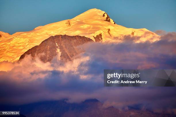 mont blanc with blue sky at sunset - sallanches stockfoto's en -beelden