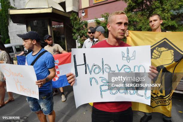 Ukrainian veterans of the war with Russia-backed separatists, hold Croatian flag and placards reading "Thank you for support", "Glory to Ukraine",...