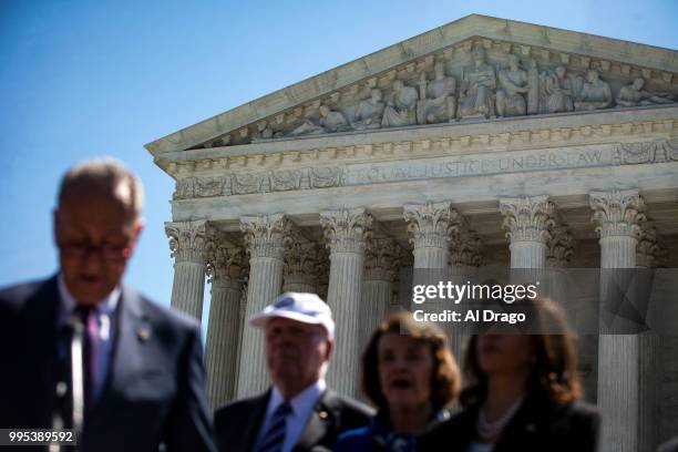 Senate Minority Leader Chuck Schumer speaks with Senate Democrats, during a news conference to "save women's reproductive rights and health care...