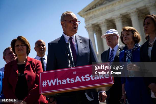Senate Minority Leader Chuck Schumer speaks with Senate Democrats, during a news conference to "save women's reproductive rights and health care...