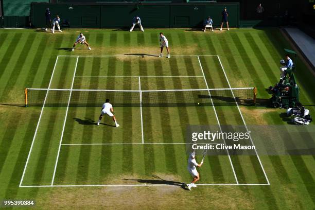 Dominic Inglot of Great Britain and Franko Skugor of Croatia compete against Robin Haase of the Netherlands and Robert Lindstedt of Sweden during...