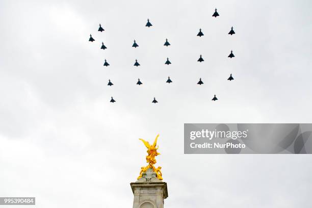 Militar aircrafts fly over The Mall and Buckingham palace as part of the celebration for the 100th anniversary of the Royal Air Force, London on July...