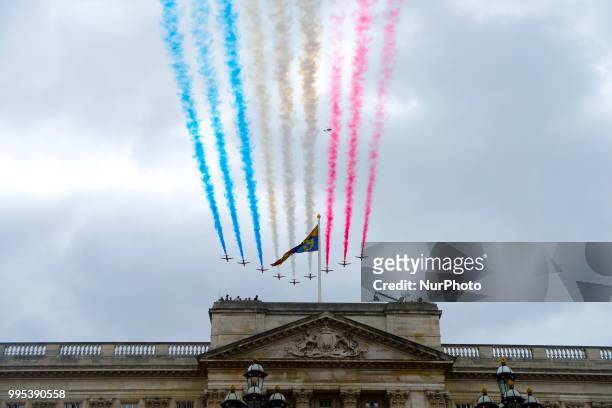 The Red Arrows flypast over Horse Guards Parade during RAF 100 celebrations on July 10, 2018 in London, England. A centenary parade and a flypast of...