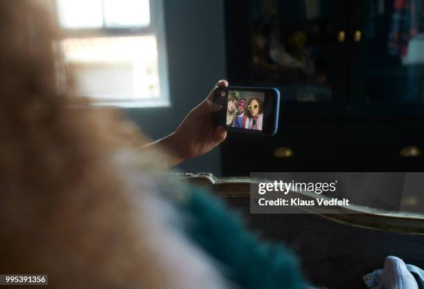 pov of girlfriends making selfie and wearing weird, funny glasses - klaus vedfelt fotografías e imágenes de stock