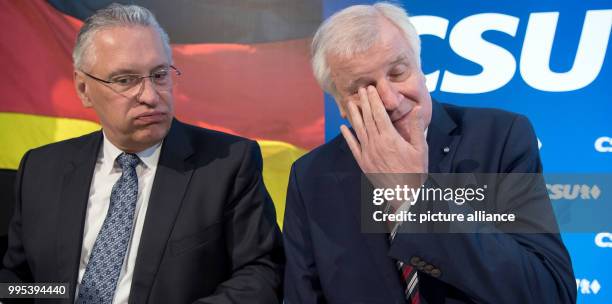 Bavarian premier Horst Seehofer and Bavarian interior minister Joachim Herrmann attend a meeting of the CSU leadership in Munich, Germany, 25...