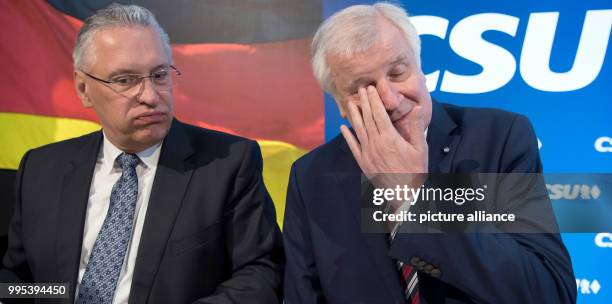 Bavarian premier Horst Seehofer and Bavarian interior minister Joachim Herrmann attend a meeting of the CSU leadership in Munich, Germany, 25...