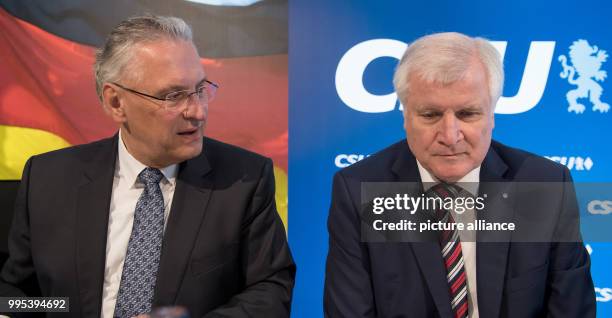 Bavarian premier Horst Seehofer and Bavarian interior minister Joachim Herrmann attend a meeting of the CSU leadership in Munich, Germany, 25...