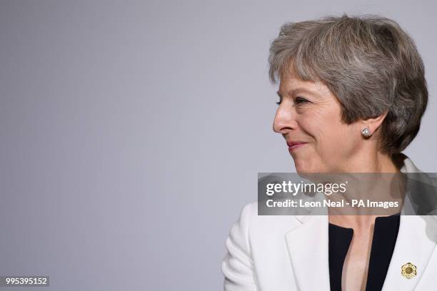 Prime Minister Theresa May takes part in the family photo during the second day of Western Balkans summit at Lancaster House, London.