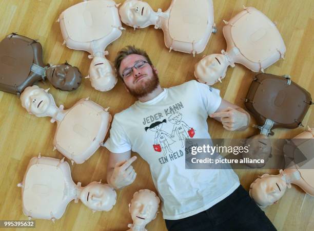 June 2018, Germany, Frankfurt : Philipp Humbsch, medical student at Charité-Universitaetsmedizin Berlin, lying on the floor of the...