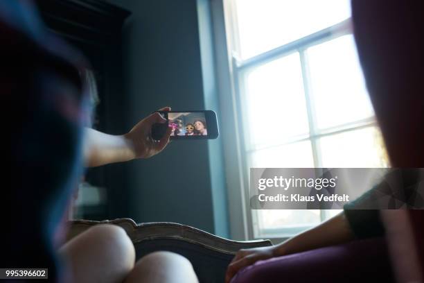 pov of girlfriends making selfie and wearing weird, funny glasses - technophile stock pictures, royalty-free photos & images