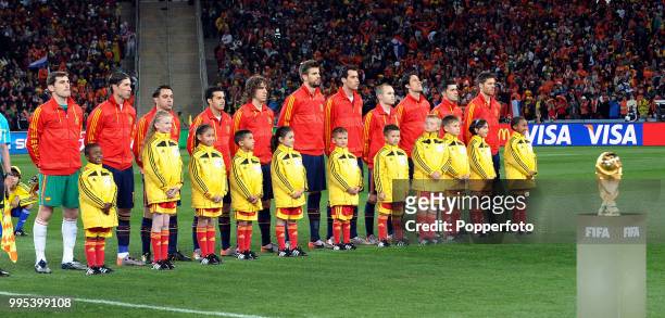 The Spain team line up for the national anthems before the FIFA World Cup Final between the Netherlands and Spain at the Soccer City Stadium on July...