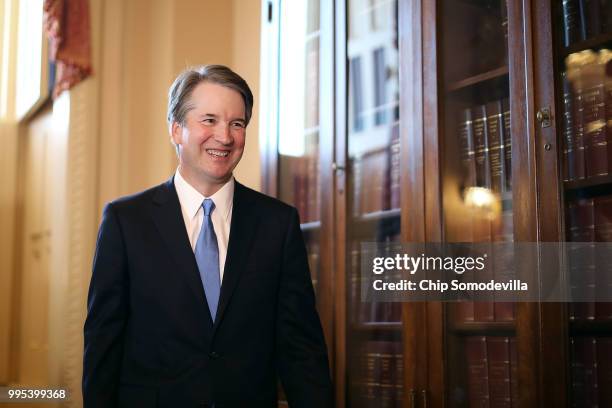 Judge Brett Kavanaugh leaves the room following a meeting and press availability with Senate Judiciary Committee Chairman Charles Grassley at the...