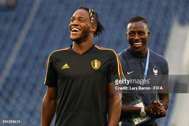 Michy Batshuayi of Belgium speaks with Benjamin Mendy of France during a pitch inspection prior to the 2018 FIFA World Cup Russia Semi Final match...
