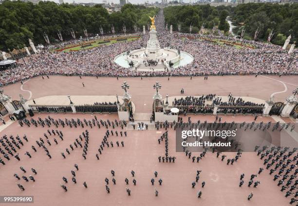 In this handout image provided by the Ministry of Defence, RAF Personnel within the grounds of Buckingham Palace form up the "RAF100" sign during RAF...