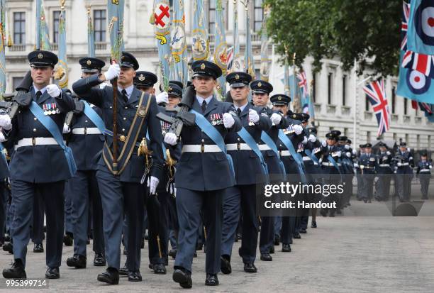 In this handout image provided by the Ministry of Defence, over 1,000 RAF servicemen and women perform a ceremonial parade, along with almost 300...