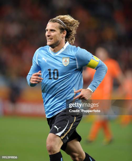 Diego Forlan of Uruguay in action during the FIFA World Cup Semi Final between Uruguay and the Netherlands at the Cape Town Stadium on July 6, 2010...