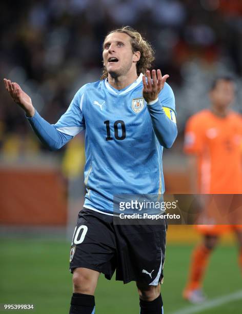 Diego Forlan of Uruguay reacts during the FIFA World Cup Semi Final between Uruguay and the Netherlands at the Cape Town Stadium on July 6, 2010 in...