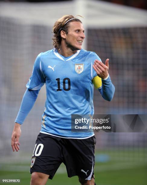 Diego Forlan of Uruguay reacts during the FIFA World Cup Semi Final between Uruguay and the Netherlands at the Cape Town Stadium on July 6, 2010 in...