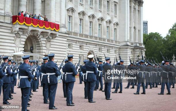 In this handout image provided by the Ministry of Defence, RAF personnel performing drills within the grounds of Buckingham Palace, whilst the Queen...