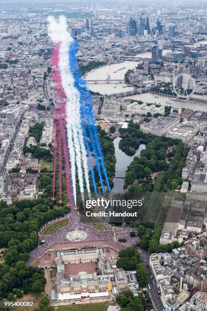 In this handout image provided by the Ministry of Defence, Red Arrows taking part in the RAF100 parade and flypast over London during RAF 100...