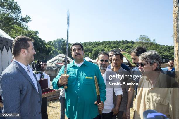 Venezuelan President Nicolas Maduro receives a present as he visits the set of famous Turkish TV show "Dirilis Ertugrul", which is broadcasted in 65...