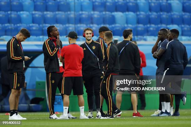 Belgium's forward Adnan Januzaj , Belgium's defender Dedryck Boyata and teammates stand on the pitch before the Russia 2018 World Cup semi-final...