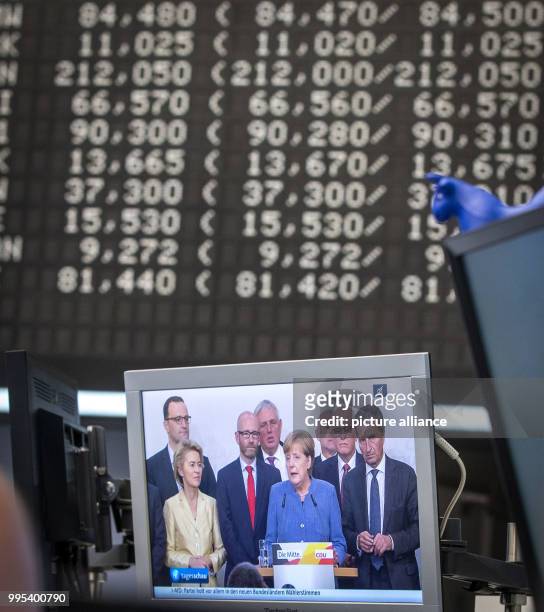 Angela Merkel is visible on a screen in the Frankfurt Stock Exchange in Frankfurt/Main, Germany, 25 September 2017. The German leading index...